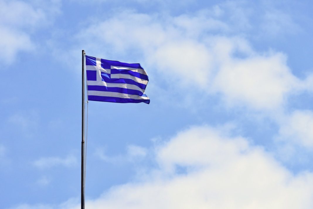 flag-greece-flying-wind-blue-sky-summer-background-travel-holidays-greece-crete-1